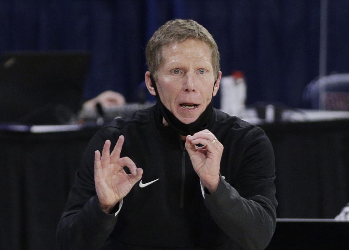 FILE - In this Feb. 25, 2021, file photo, Gonzaga coach Mark Few signals to players during the second half of an NCAA college basketball game against Santa Clara in Spokane, Wash. Few has been cited for driving under the influence. The Coeur d'??Alene Press and Spokesman-Review acquired a police report through a public information request that says Few was stopped Monday evening, Sept. 6, after he was '??called in as driving erratic and speeding.'??