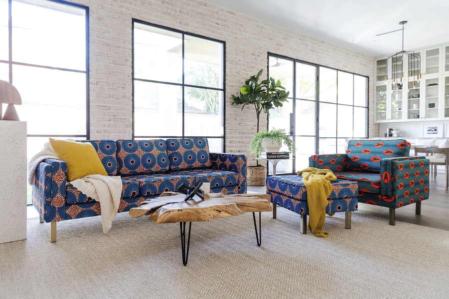 This photo provided by Albany Park shows the Ekaabo seating collection. Albany Park's founder Darryl Sharpton drew on his Nigerian heritage to create his Ekaabo seating collection. The name means 'welcome home', and the velvet upholstery's dynamic blue, orange and burgundy graphics echo West African design.