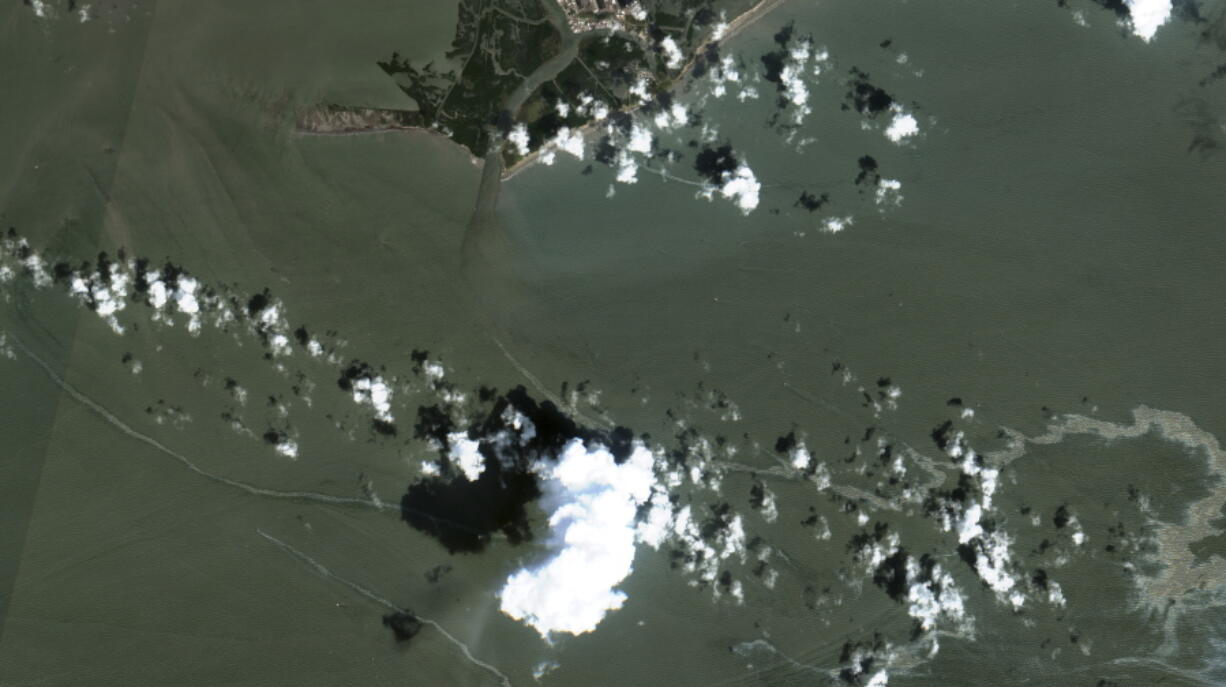 In a satellite image provided by Maxar Technologies, an oil slick is shown on Sept. 2, 2021 south of Port Fourchon, La.  The U.S. Coast Guard said Saturday, Sept. 4,  that cleanup crews are responding to a sizable oil spill in the Gulf of Mexico following Hurricane Ida.