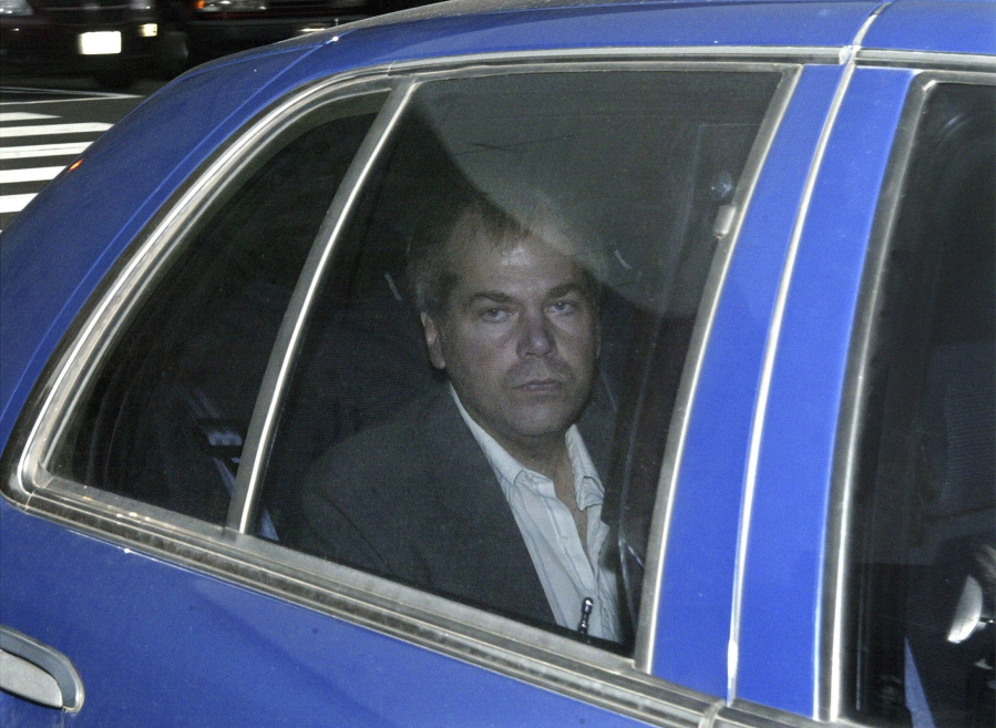 FILE - In this Nov. 18, 2003, file photo, John Hinckley Jr. arrives at U.S. District Court in Washington. Lawyers for Hinckley, the man who tried to assassinate President Ronald Reagan, are scheduled to argue in court Monday, Sept. 27, 2021, that the 66-year-old should be freed from restrictions placed on him after he moved out of a Washington hospital in 2016.