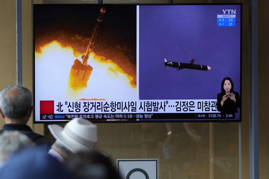 People watch a TV screen showing a news program reporting about North Korea's long-range cruise missiles tests with images in Seoul, South Korea, Monday, Sept. 13, 2021. North Korea says it successfully test fired newly developed long-range cruise missiles over the weekend, its first known testing activity in months, underscoring how it continues to expand its military capabilities amid a stalemate in nuclear negotiations with the United States.