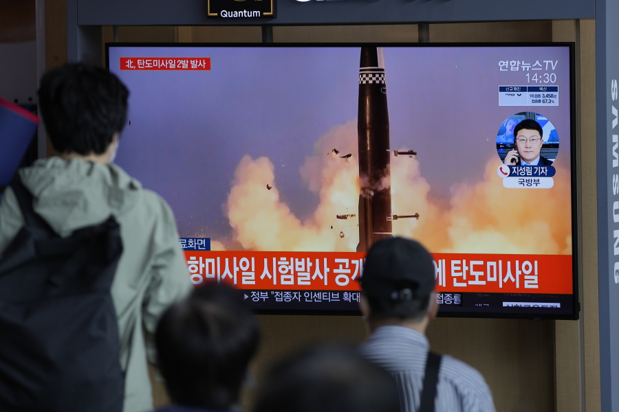 People watch a TV screen showing a news program reporting about North Korea's missiles with file image in Seoul, South Korea, Wednesday, Sept. 15, 2021. North Korea fired two ballistic missiles into waters off its eastern coast Wednesday afternoon, two days after claiming to have tested a newly developed missile in a resumption of its weapons displays after a six-month lull.