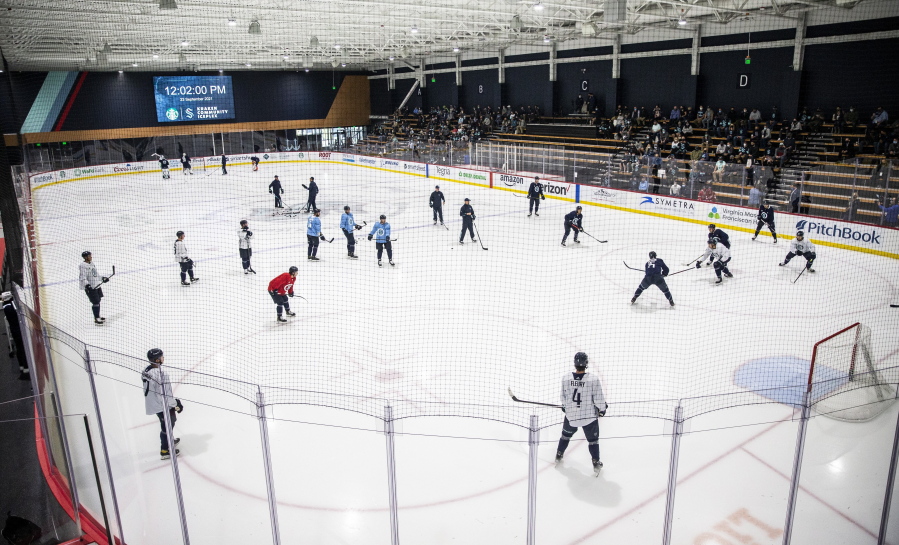 Seattle Kraken players and coaches workout during NHL hockey training camp at Kraken Community Iceplex on Thursday, Sept. 23, 2021, in Seattle.