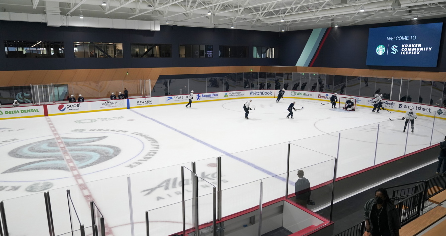Seattle Kraken players take part in a practice session, Thursday, Sept. 9, 2021, during a media event for the grand opening of the Kraken's NHL hockey practice and community facility in Seattle. (AP Photo/Ted S.