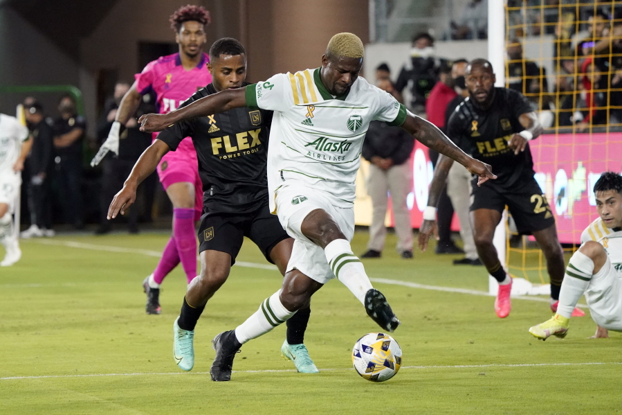 Portland Timbers forward Dairon Asprilla controls the ball in front of a Los Angeles FC defender during the first half of an MLS soccer match Wednesday, Sept. 29, 2021, in Los Angeles.