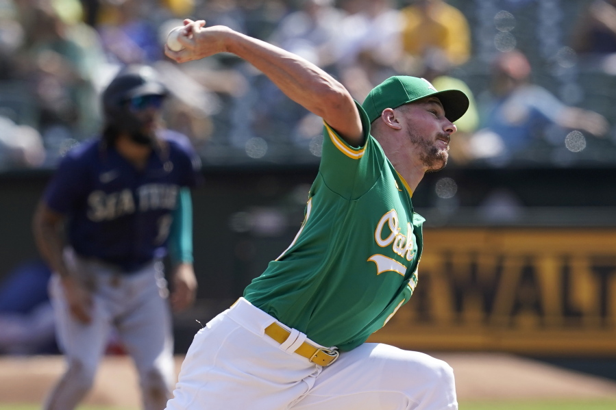 Oakland Athletics' Chris Bassitt pitches against the Seattle Mariners during the first inning of a baseball game in Oakland, Calif., Thursday, Sept. 23, 2021.