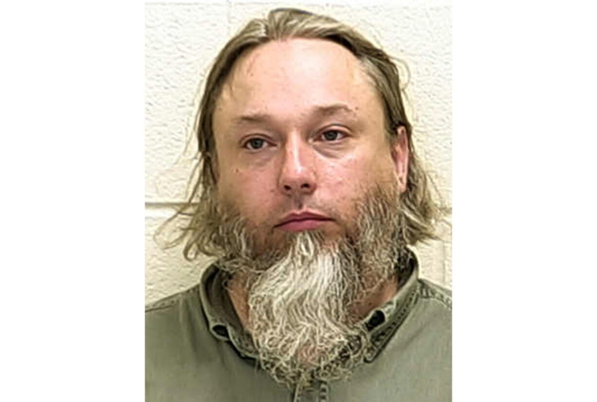 FILE - This undated file photo provided by The Ford County Sheriff's Office in Paxton, Ill., shows Michael Hari, a militia leader convicted of masterminding the bombing of a Minnesota mosque, Hari is now known by her transgender identity, Emily Claire Hari. Hari, the leader of an Illinois anti-government militia group who authorities say masterminded the 2017 bombing of a Minnesota mosque is to be sentenced Monday, Sept. 13, 2021. Emily Claire Hari, who was previously known as Michael Hari and recently said she is transgender, faces a mandatory minimum of 30 years in prison for the attack on Dar al-Farooq Islamic Center.