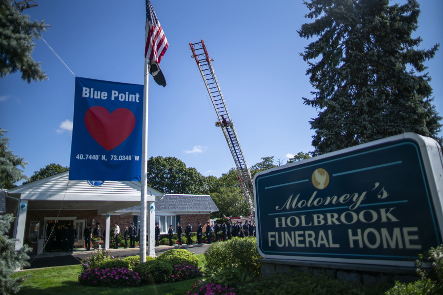 Long Island firefighters attend the funeral service of Gabby Petito at Moloney's Holbrook Funeral Home in Holbrook, N.Y. Sunday, Sept. 26, 2021.