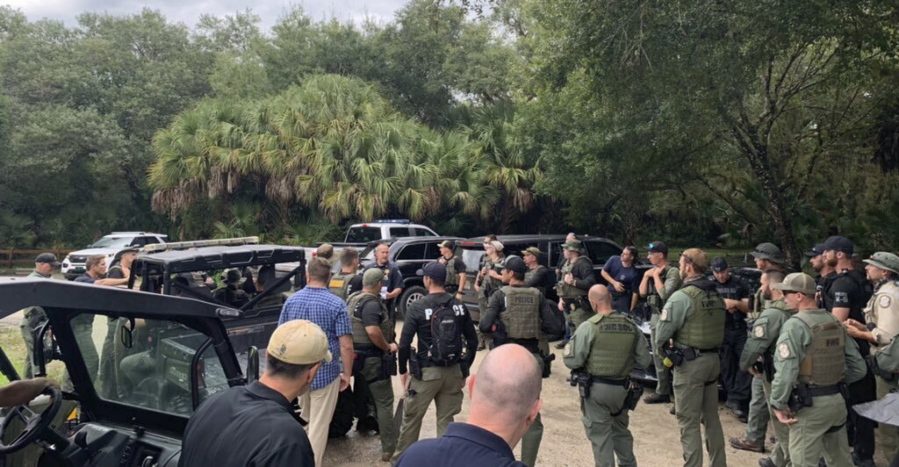 This photo provided by North Port Police Department, law enforcement officials conduct a search of the vast Carlton Reserve in the Sarasota, Fla., area for Brian Laundrie on Saturday, Sept. 18, 2021.  Laundrie is a person of interest in the disappearance of his girlfriend, Gabrielle "Gabby" Petito.