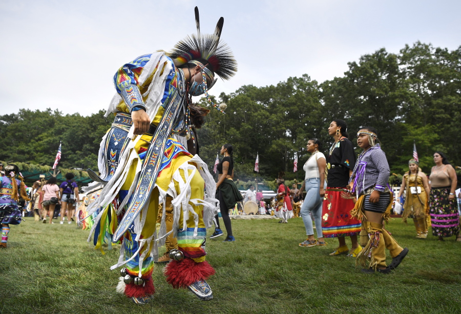 A dancer participates in an intertribal dance at Schemitzun on the Mashantucket Pequot Reservation in Mashantucket, Conn., Saturday, Aug. 28, 2021. Connecticut and a handful of other states have recently decided to mandate students be taught about Native American culture and history.
