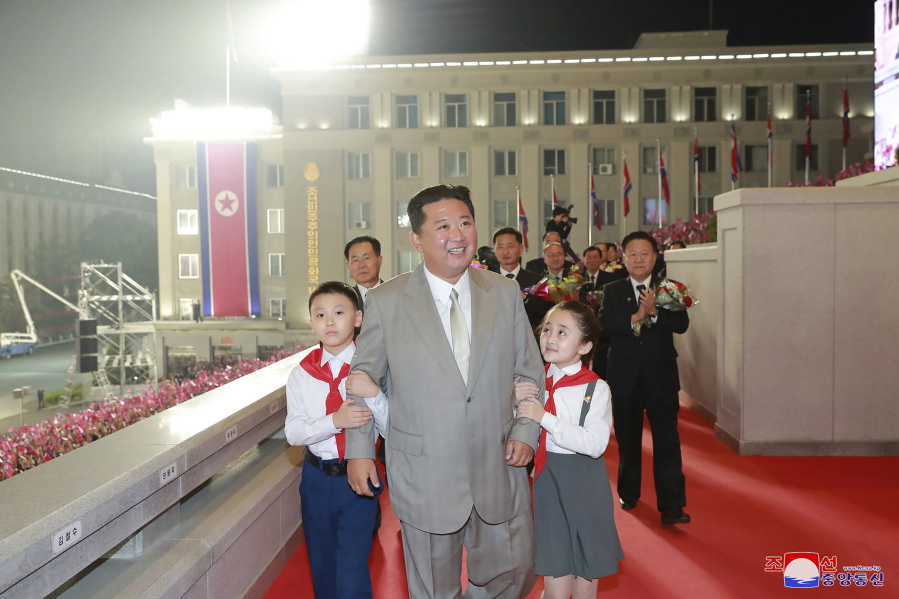 In this photo provided by the North Korean government, North Korean leader Kim Jong Un walks with children during a celebration of the nation's 73rd anniversary at Kim Il Sung Square in Pyongyang, North Korea, early Thursday, Sept. 9, 2021. Independent journalists were not given access to cover the event depicted in this image distributed by the North Korean government. The content of this image is as provided and cannot be independently verified. Korean language watermark on image as provided by source reads: "KCNA" which is the abbreviation for Korean Central News Agency.