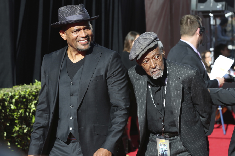 FILE - Mario Van Peebles, from left and Melvin Van Peebles arrive at the screening of "The Producers" at the 2018 TCM Classic Film Festival Opening Night at the TCL Chinese Theatre on Thursday, April 26, 2018, in Los Angeles. Melvin Van Peebles, a Broadway playwright, musician and movie director whose work ushered in the "blaxploitation" films of the 1970s, has died at age 89. His family said in a statement that Van Peebles died Tuesday night, Sept. 21, 2021, at his home.