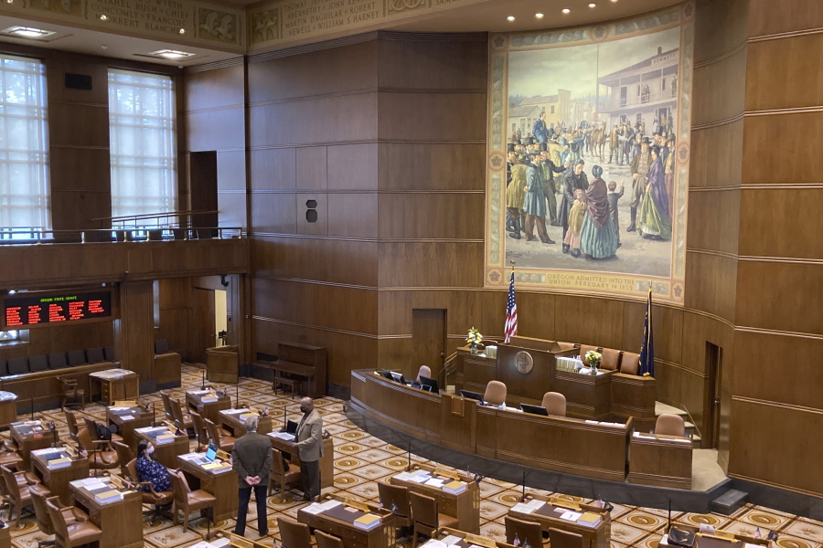 A handful of senators talk on the floor of the Oregon State Senate on Monday, Sept. 20, 2021, as the Oregon Legislature conducted a special session to consider redistricting. The aim of the session is to pass new legislative and congressional district maps which the state will use for elections.
