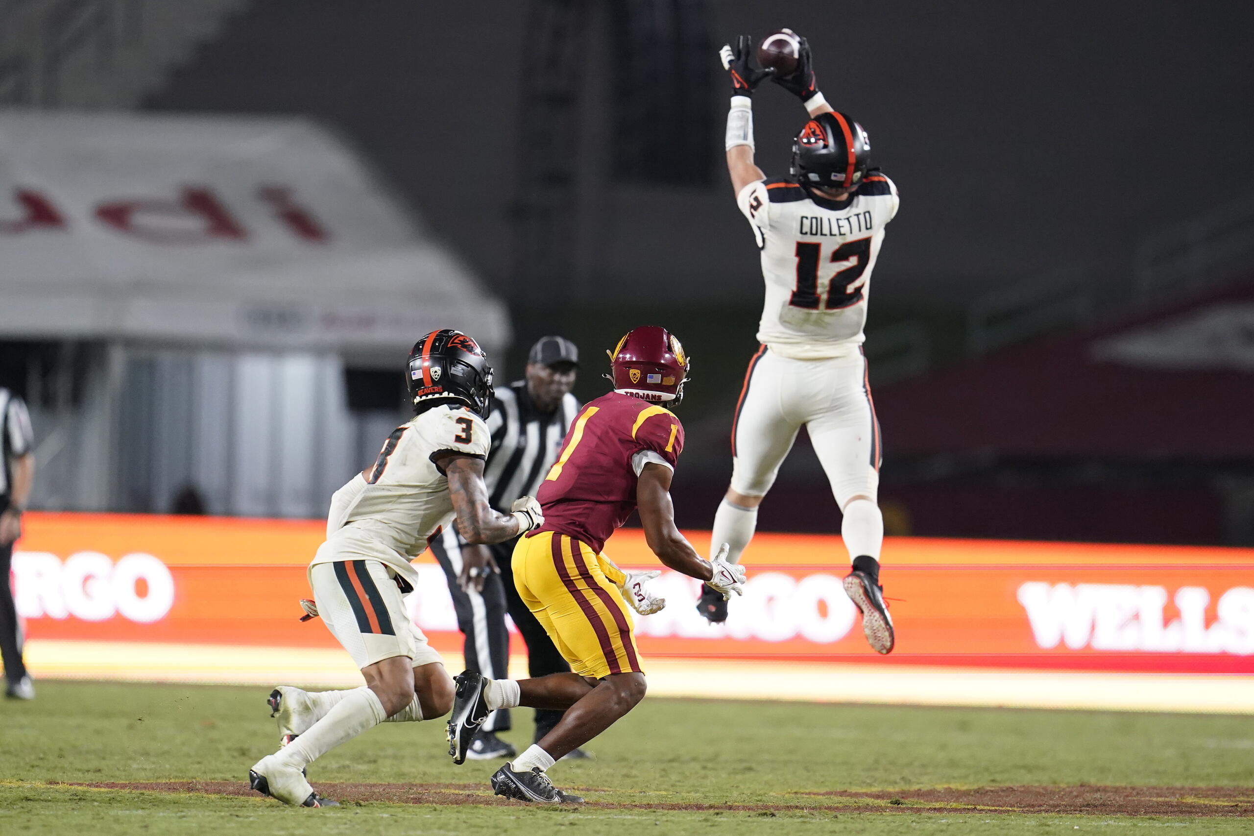 Oregon State linebacker Jack Colletto (12) jumps in front of Southern California wide receiver Gary Bryant Jr. (1) to intercept a pass during the second half of an NCAA college football game Saturday, Sept. 25, 2021, in Los Angeles.