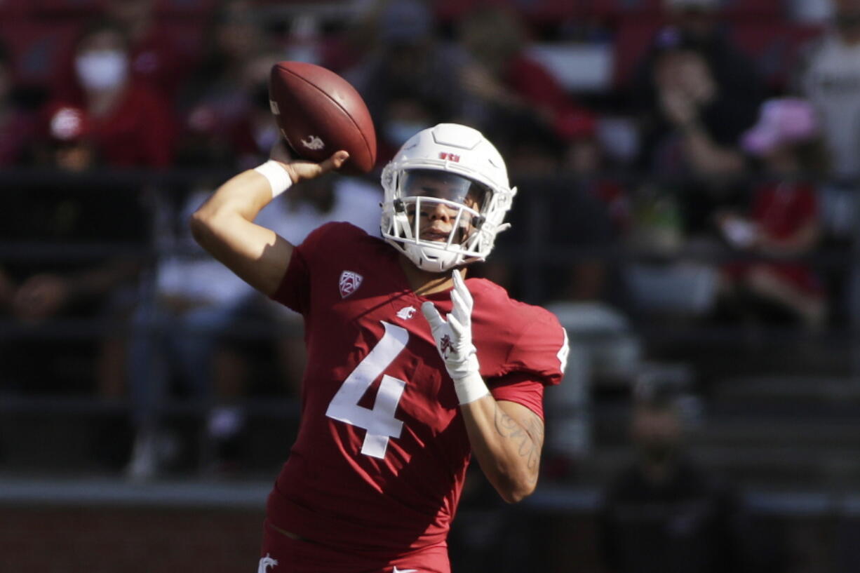 Washington State quarterback Jayden de Laura throws a pass during the first half of an NCAA college football game against Portland State, Saturday, Sept. 11, 2021, in Pullman, Wash.