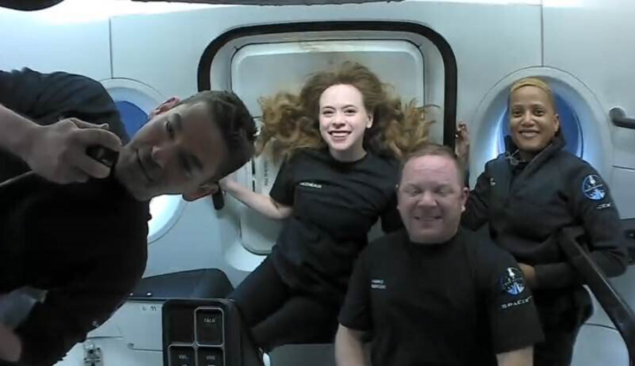 This photo provided by SpaceX shows the passengers of Inspiration4 in the Dragon capsule on their first day in space. They are, from left, Jared Isaacman, Hayley Arceneaux, Chris Sembroski and Sian Proctor.   SpaceX got them into a 363-mile (585-kilometer) orbit following Wednesday night's launch from NASA's Kennedy Space Center. That's 100 miles (160 kilometers) higher than the International Space Station.