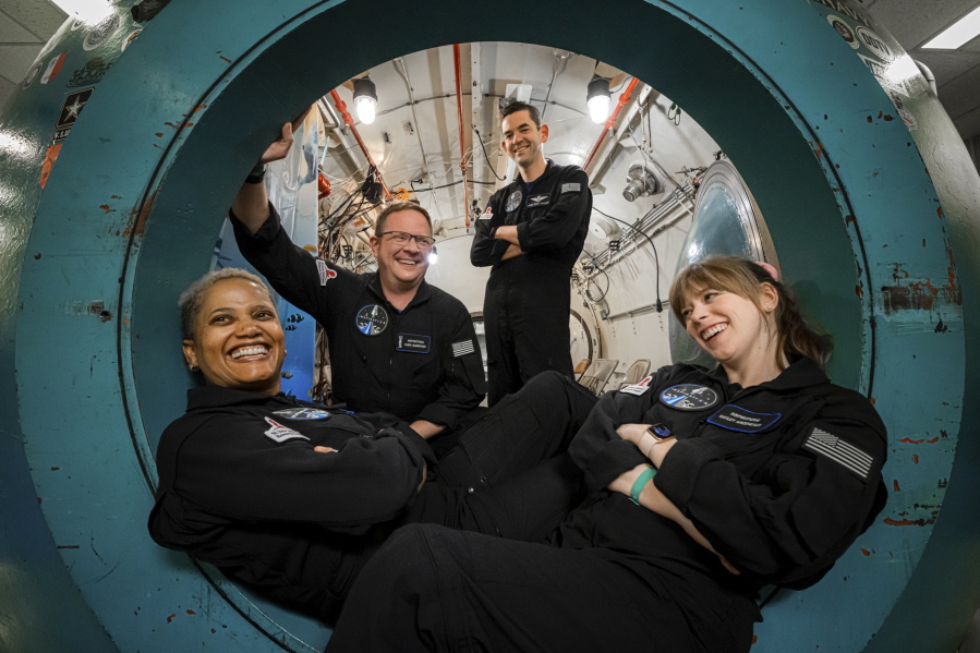 In this July 2, 2021 photo provided by John Kraus, from left, Sian Proctor, Chris Sembroski, Jared Isaacman and Hayley Arceneaux pose for a photo at Duke Health in Durham, N.C, during hypoxia training to understand how each crew member reacts in a low-oxygen environment.