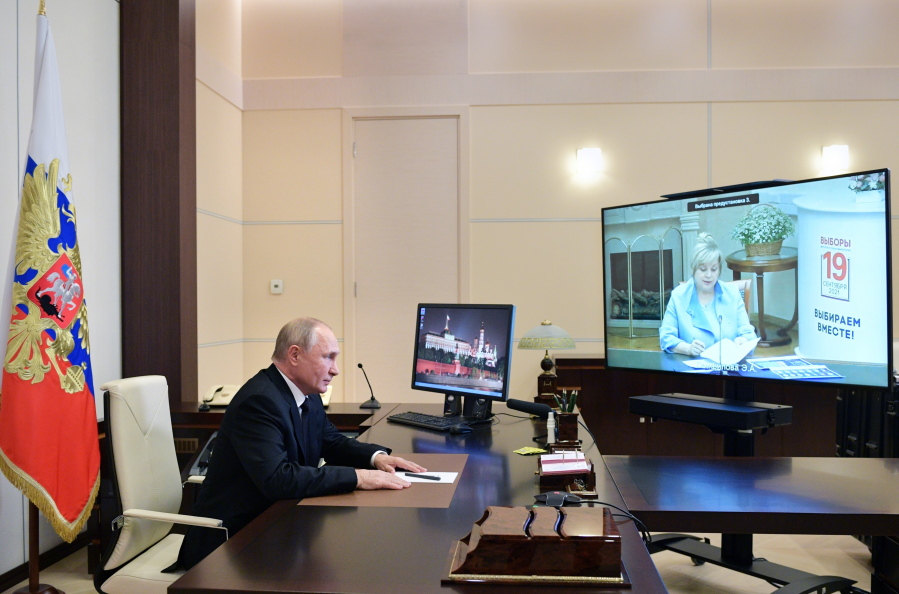 Russian President Vladimir Putin speaks to Ella Pamfilova, head of Russian Central Election Commission, on the screen, during their meeting via video conference at the Novo-Ogaryovo residence outside Moscow, Russia, Monday, Sept. 20, 2021.