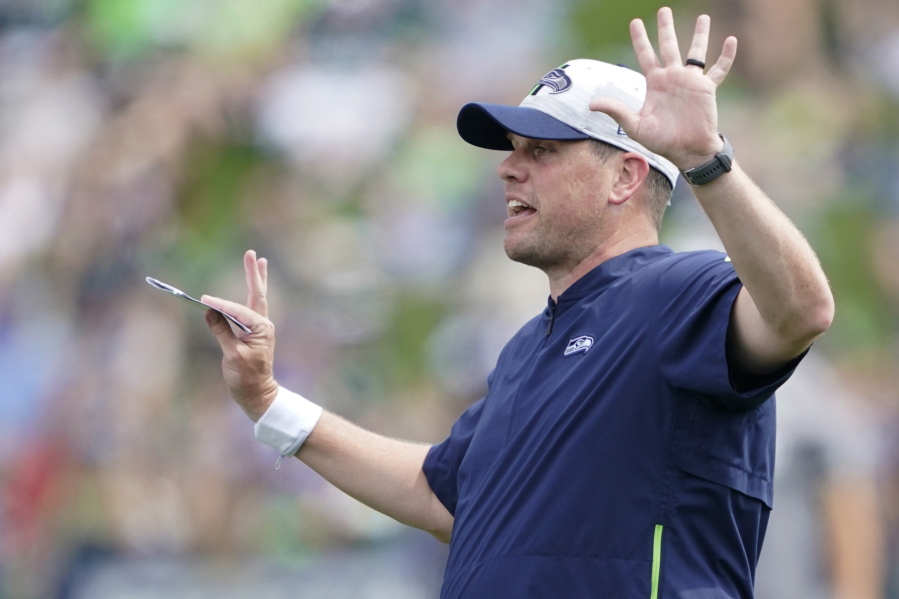 Seattle Seahawks offensive coordinator Shane Waldron calls to players during practice in Renton. Tasked with modernizing Seattle's offense and making Russell Wilson happy, Waldron's system finally gets its unveiling in the opener on Sunday against Indianapolis. (AP Photo/Ted S.