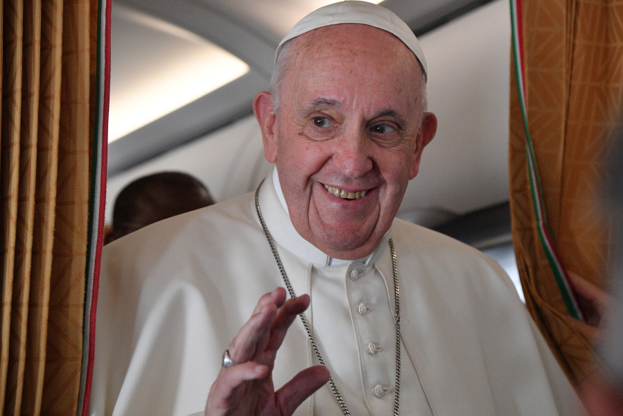 Pope Francis speaks with journalists on board an Alitalia aircraft enroute from Bratislava back to Rome, Wednesday, Sept. 15, 2021 after a four-day pilgrimage to Hungary and Slovakia.