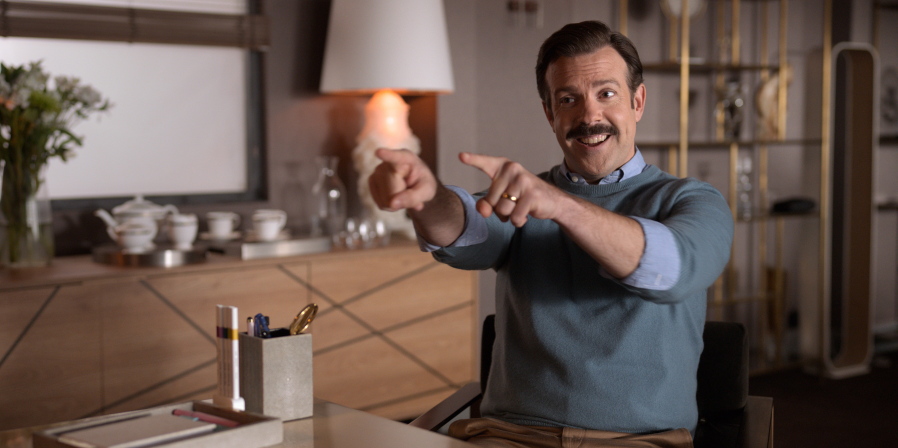 This image released by Apple TV Plus shows Jason Sudeikis in "Ted Lasso." Sudeikis is nominated for an Emmy Award for outstanding leading actor in a comedy series.