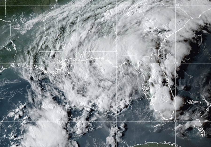 This GOES- East GeoColor satellite image taken Wednesday, Sept. 8, 2021, at 10:30 p.m. EDT., and provided by NOAA, shows Tropical Storm Mindy as it makes landfall on the Florida Panhandle. The storm touched down over St. Vincent Island, about 10 miles (15 km) west southwest of Apalachicola, according to the National Hurricane Center.