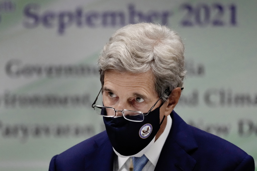 In this Sept. 13, 2021 photo, U.S. Special Presidential Envoy for Climate John Kerry listens to a speech at the launch of Climate Action and Finance Mobilisation Dialogue (CAFMD) under India-US Agenda 2030 Partnership in New Delhi, India. Kerry's quest to stave off the worst scenarios of global warming is meeting resistance from China, the world's biggest climate polluter, which is adamant that the United States ease confrontation over other matters if it wants Beijing to speed up its climate efforts.