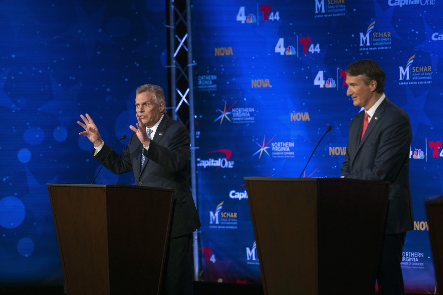 Virginia Democratic gubernatorial candidate and former Gov. Terry McAuliffe, left, and Republican challenger, Glenn Youngkin, participate in a debate at Northern Virginia Community College, in Alexandria, Va., Tuesday, Sept. 28, 2021.