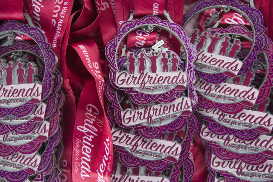 Medals are ready to award to participants of a previous Girlfriends Half Marathon in Vancouver. The 15th edition of the race is set for Sunday, starting and finishing at the Vancouver Waterfront.