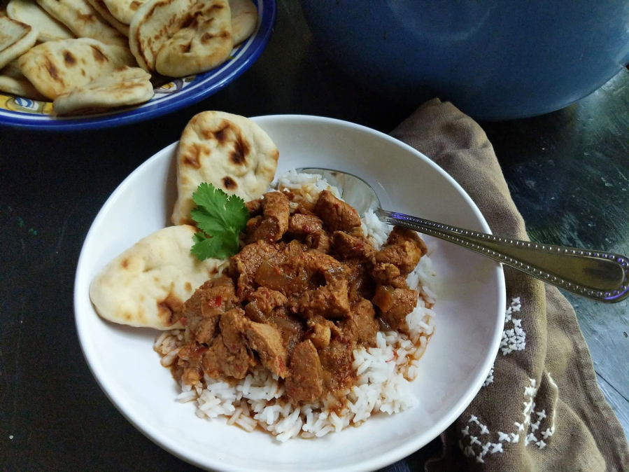 "Vindaloo" usually conjures up a searingly hot curry, but this recipe is relatively mild. It's made with pork butt and dried guajillo chiles.