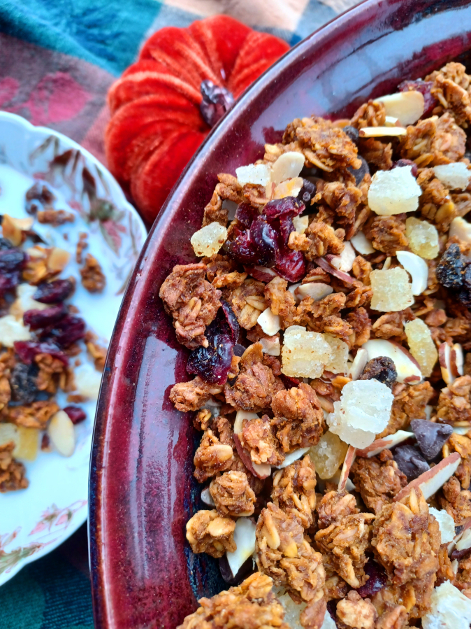This pumpkin granola contains a whole can of pumpkin puree with spices, maple syrup, brown sugar and dried fruit.