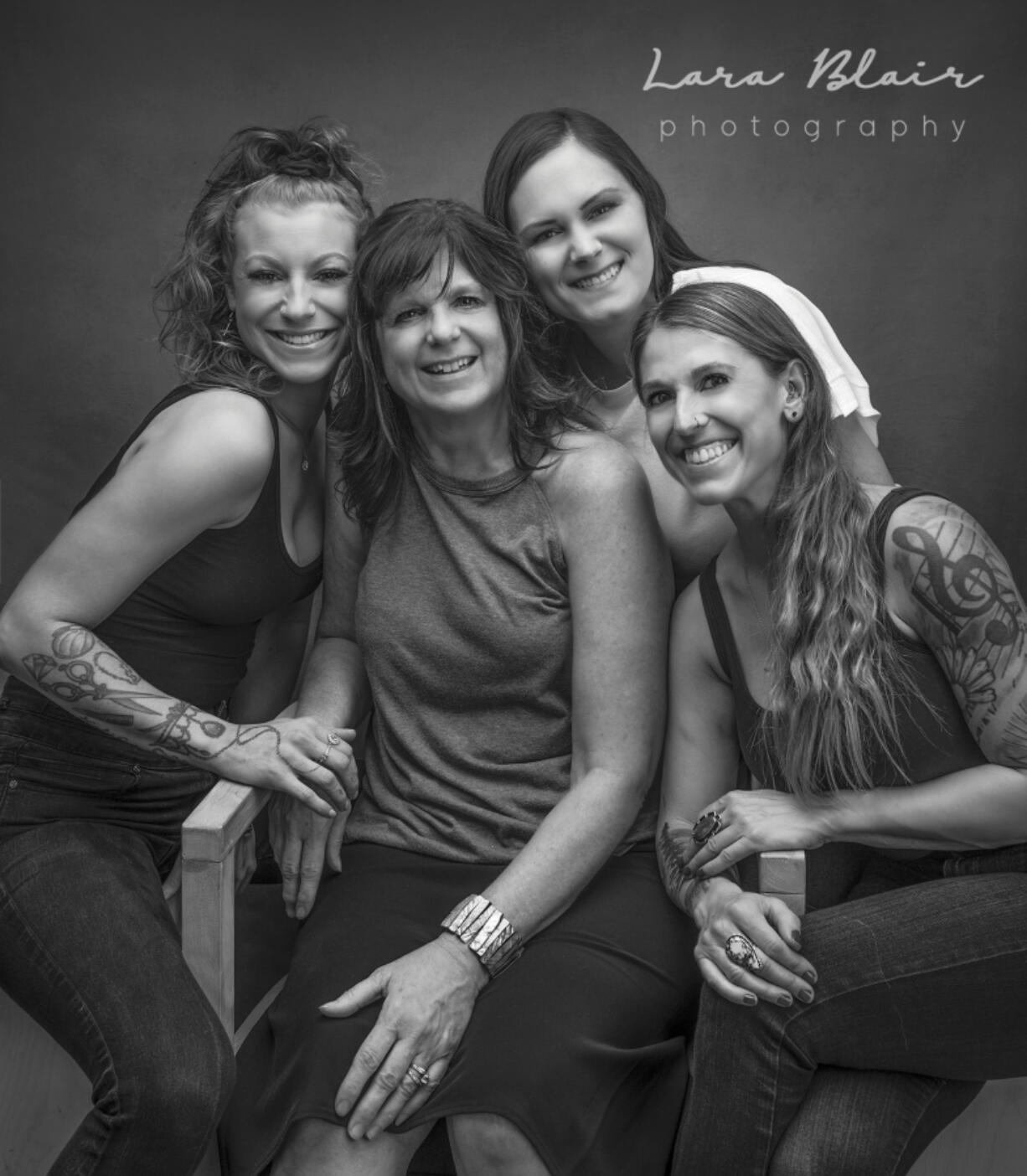 Photographer Lara Blair's work includes a portrait of Caffe Piccolo's barista Britteny Goodwin, left, owner Jodi Vaughan and baristas Meagan Rea and Allie Hotra.