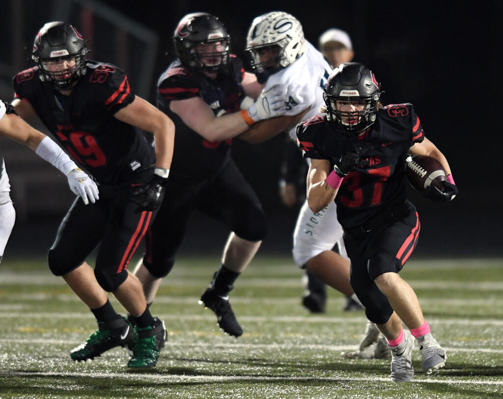 Camas senior Jon Schultz (37) runs down the field Friday, Oct. 22, 2021, during the Papermakers’ 17-7 win against Skyview at Camas High School.