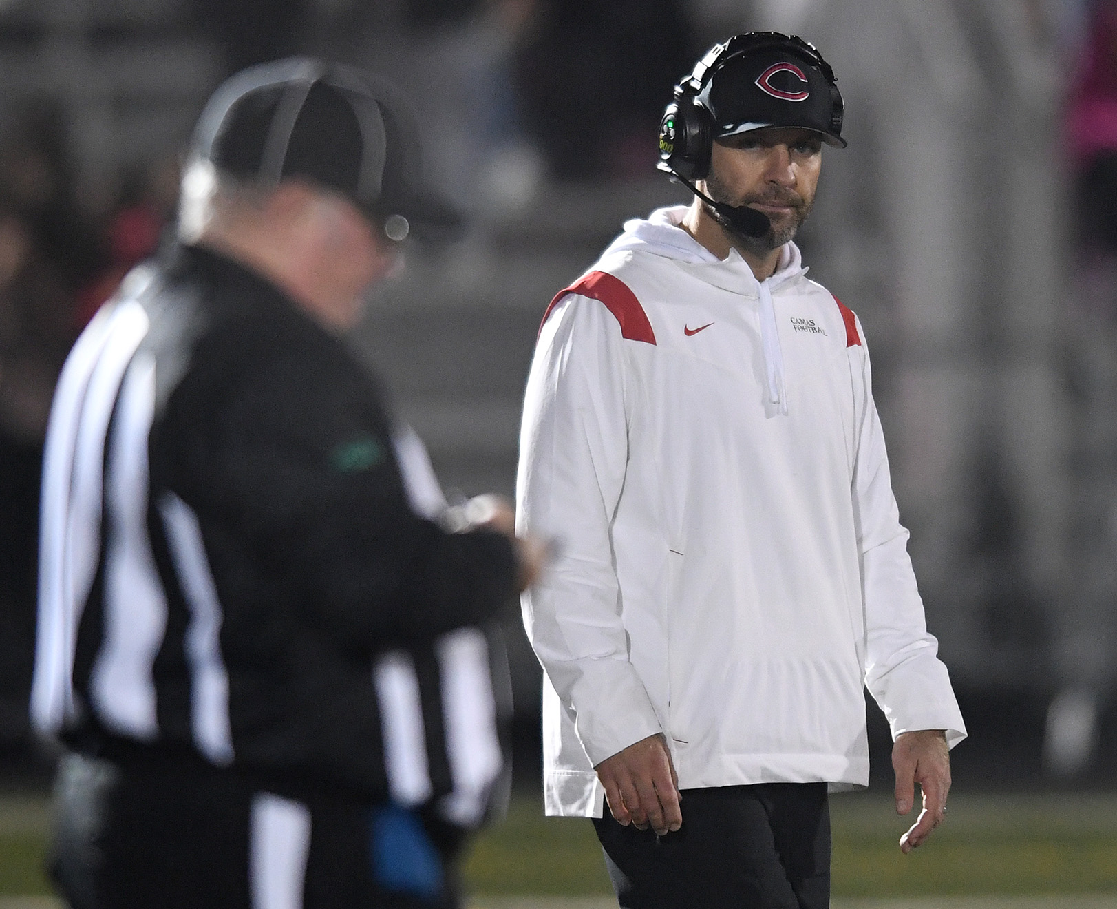Camas head football coach Jack Hathaway looks down he sideline Friday, Oct. 22, 2021, during the Papermakers’ 17-7 win against Skyview at Camas High School.