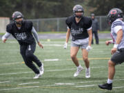 Camas seniors Jairus Phillips, left, and Luke Jamison participate in a special teams drill Wednesday, Oct. 27, 2021, during practice at Camas High School.
