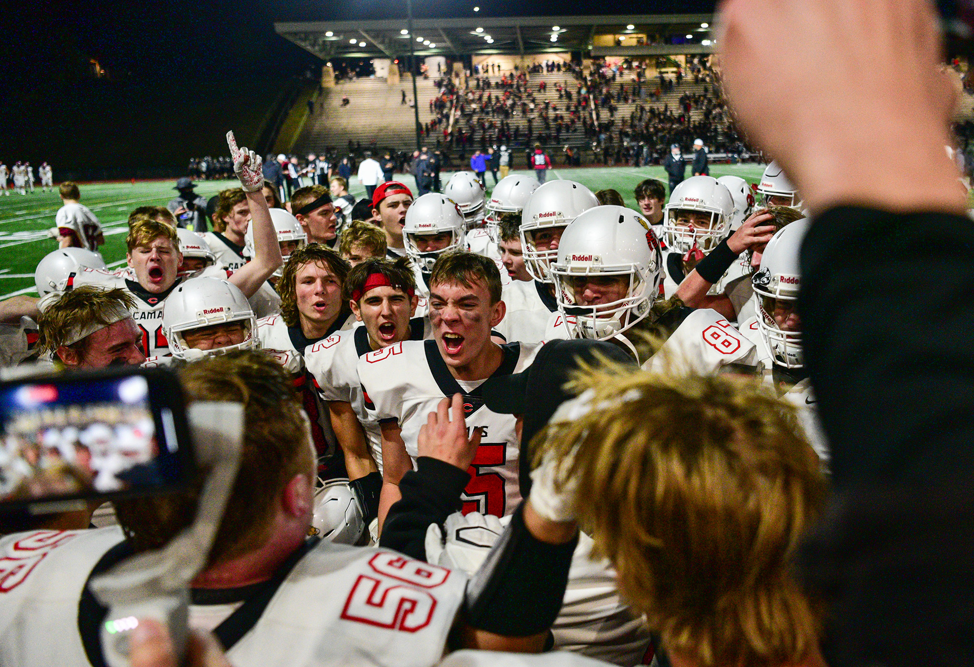 Camas players celebrate Friday, Oct. 29, 2021, following the Papermakers’ 17-7 win against Union at McKenzie Stadium in Vancouver.