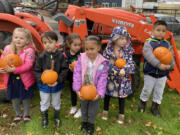 Hathaway Elementary School kindergarten students enjoy a pumpkin patch and activities at the school's playground Oct. 22.