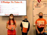 Sunset Ridge Intermediate School Leadership students shared information on the Pledge Posters and the Bucket Brigade.