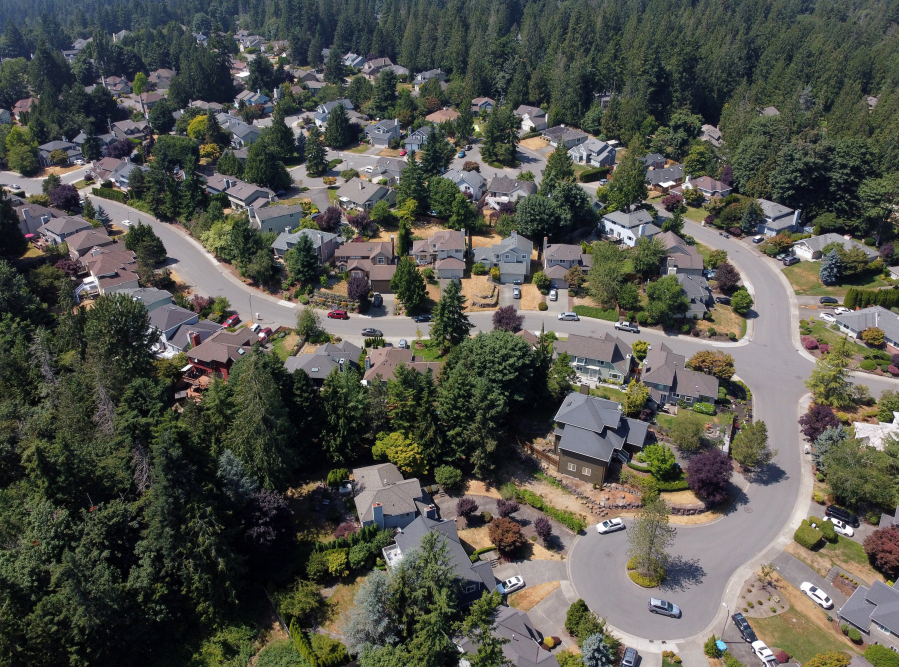A Sammamish, Washington, neighborhood of single-family homes is seen from the air, almost 2 miles north of a planned mixed-use development known as "Town Center," on July 14, 2021.