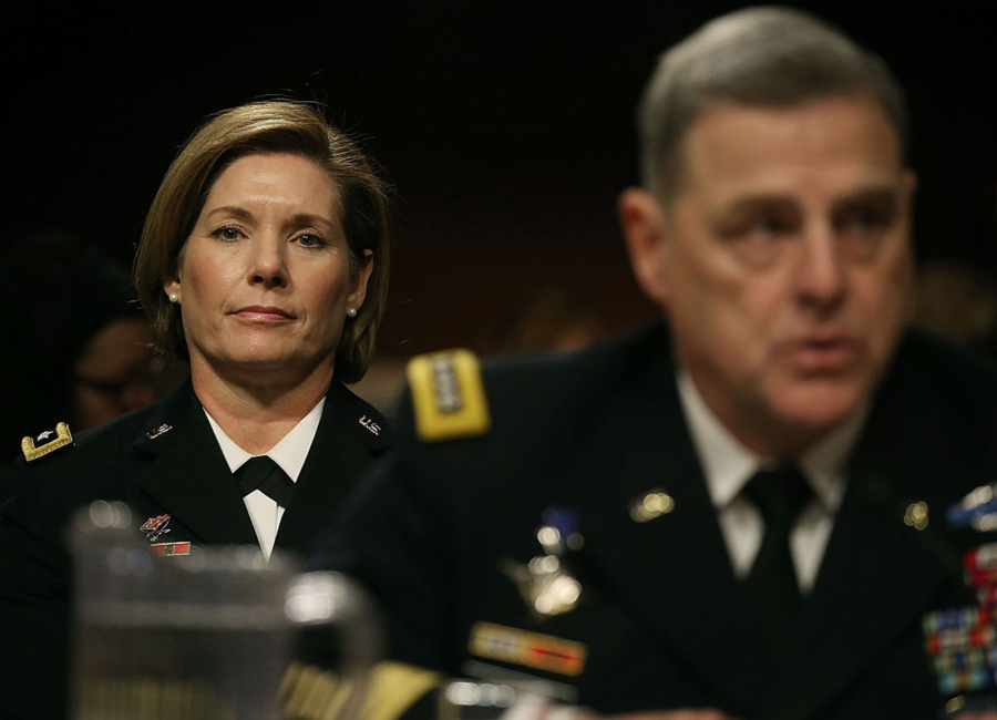 U.S. Army Gen. Laura Richardson sits behind U.S. Army Chief of Staff Mark Milley while he testifies about women in the military during a Senate Armed Services Committee hearing on Capitol Hill, Feb. 2, 2016, in Washington, D.C. The issue of women and the draft has come up in Congress recently.