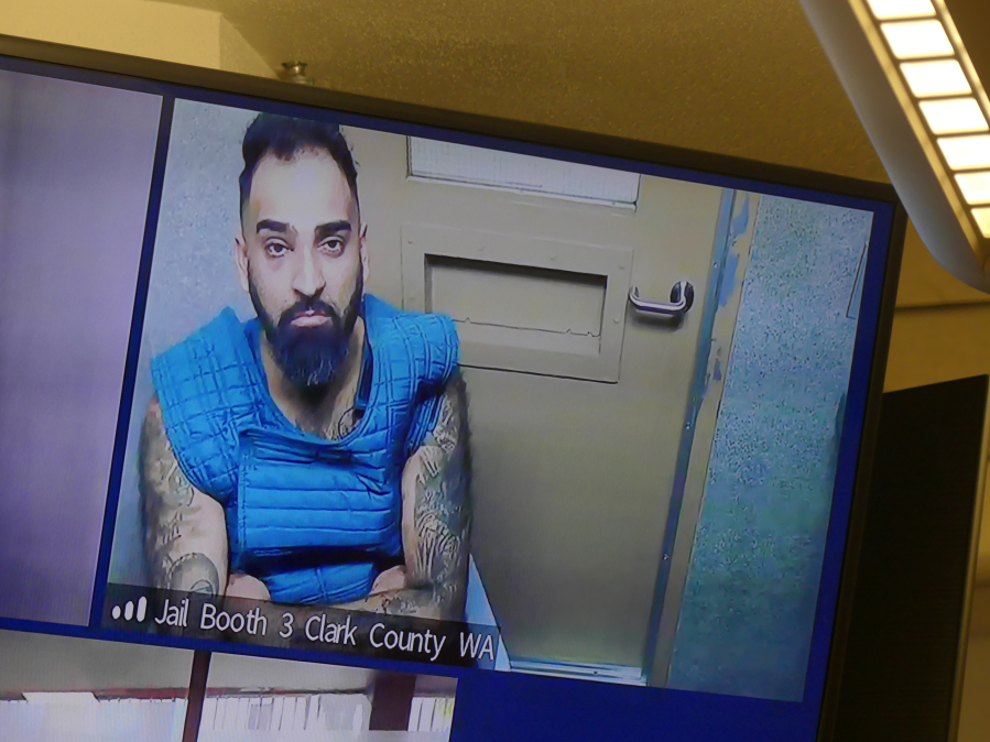 Jessica Prokop/The Columbian
Aarondeep Johal, 32, makes a first appearance via video Monday in Clark County Superior Court in an attempted murder and kidnapping case involving his girlfriend.