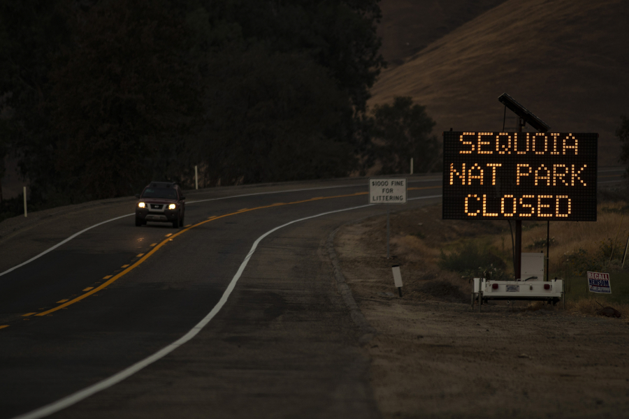 A sign warns motorists of the closure of Sequoia National Park as the KNP Complex fire threatens the area on Sept. 15, 2021 in Three Rivers, California.