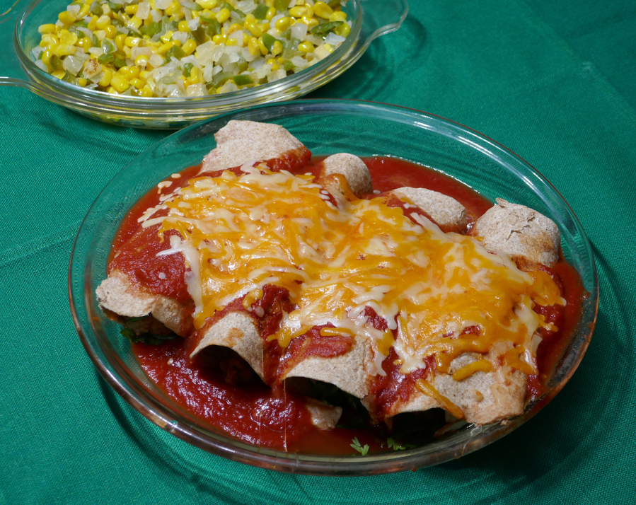 Chicken enchiladas with esquites (sauteed corn).