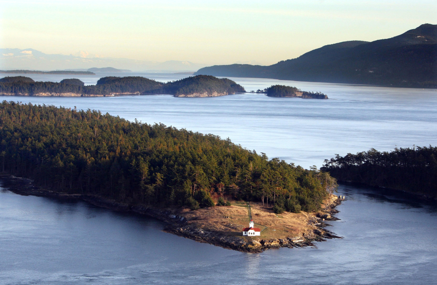 Steve Ringman/The Seattle Times 
  
 The lighthouse on the northern tip of Patos Island, with Sucia Island and Orcas Island in the distance, looks toward Canada across The Salish Sea.