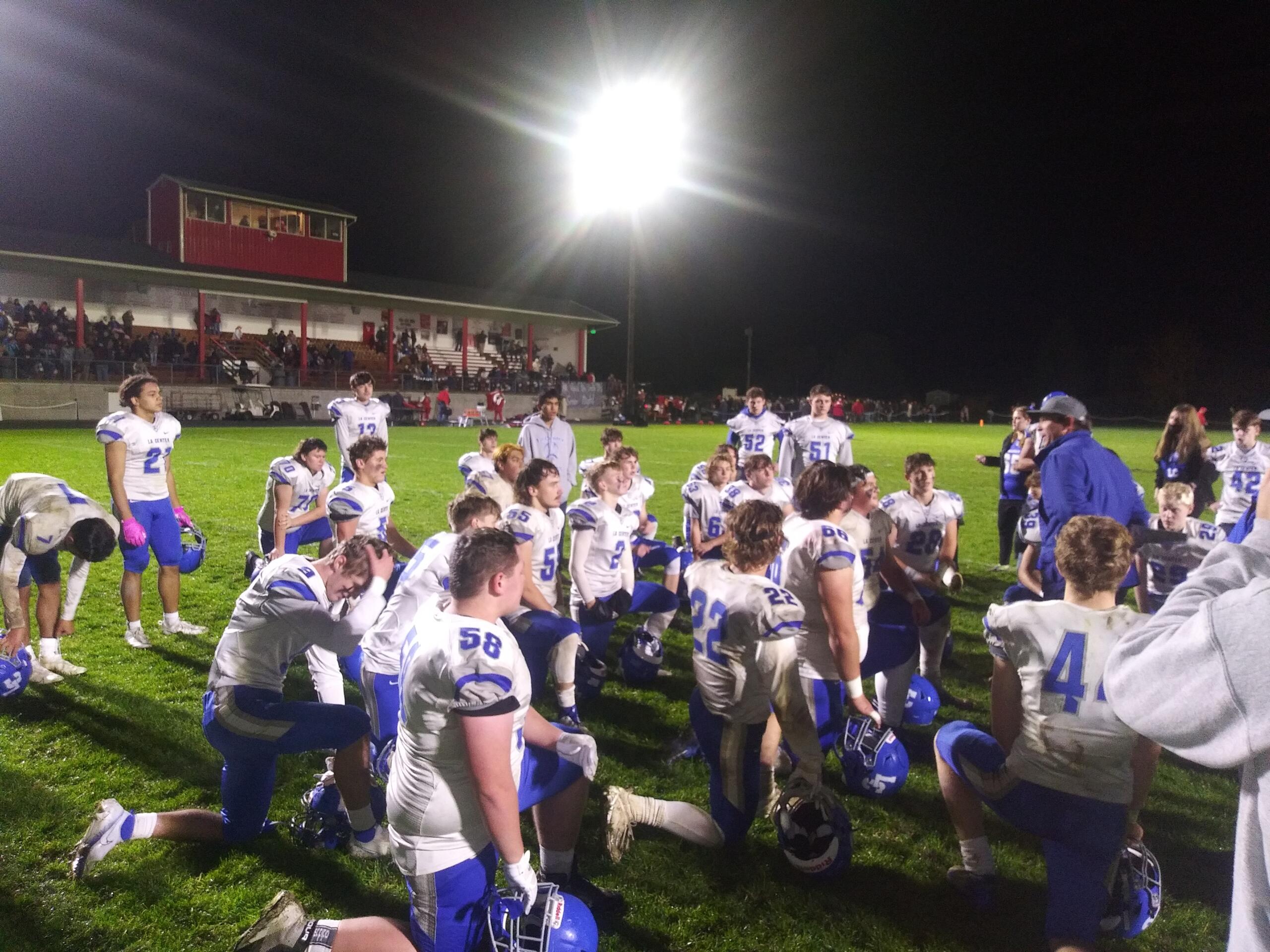 La Center coach John Lambert talks to his plyers after the Wildcats' 31-14 win over Castle Rock to clinch the Trico League championship (Tim Martinez/The Columbian)