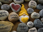 Rocks with the names of people that were victims of the coronavirus pandemic. In Washington, more than a thousand children lost a parent or caregiver to COVID-19.