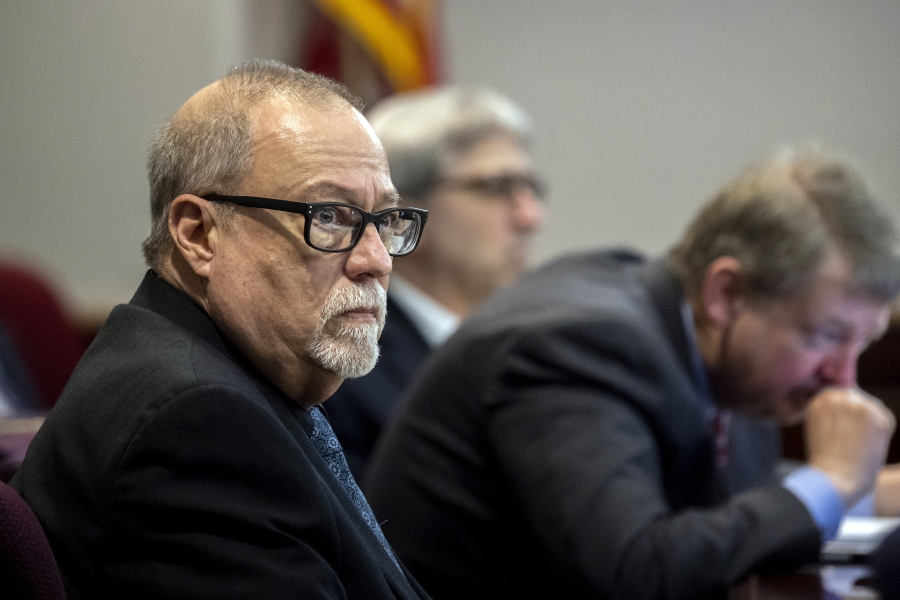 Greg McMichael. left, listens to jury selection for the trial of him and his son, Travis McMichael, and a neighbor, William "Roddie" Bryan, at the Glynn County Courthouse, Monday, Oct. 25, 2021, in Brunswick, Ga. The three are charged with the February 2021 slaying of 25-year-old Ahmaud Arbery. (AP Photo/Stephen B.