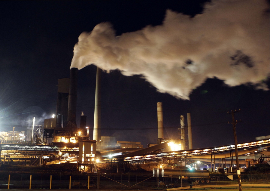 In this July 8, 2011 file photo, smoke bellows from a chimney stack at BlueScope Steel's mill at Port Kembla, south of Sydney, Australia. Australia was the worst climate performer among comparable developed countries since the 2015 Paris Agreement imposed binding commitments to limit global warming, a think tank reported on Thursday Oct. 21, 2021, ahead of an important conference in Scotland later this month.