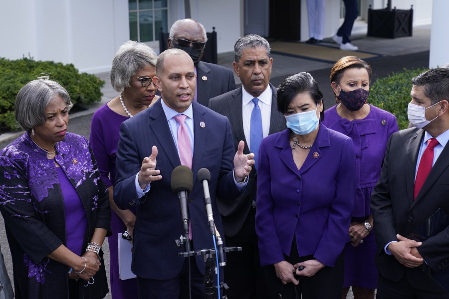 Rep. Hakeem Jeffries, D-N.Y., standing with other House Democrats, talks to reporters outside the West Wing of the White House in Washington, Tuesday, Oct. 26, 2021, following a meeting with President Joe Biden to work out details of the Biden administration's domestic agenda.