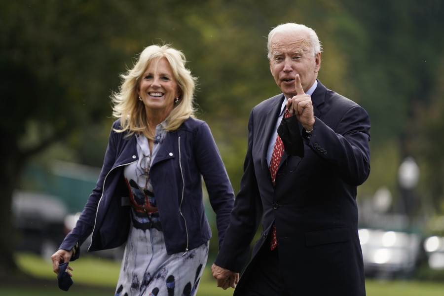 President Joe Biden and first lady Jill Biden arrive on the South Lawn of the White House after spending the weekend in Wilmington, Del., Monday, Oct. 4, 2021, in Washington.